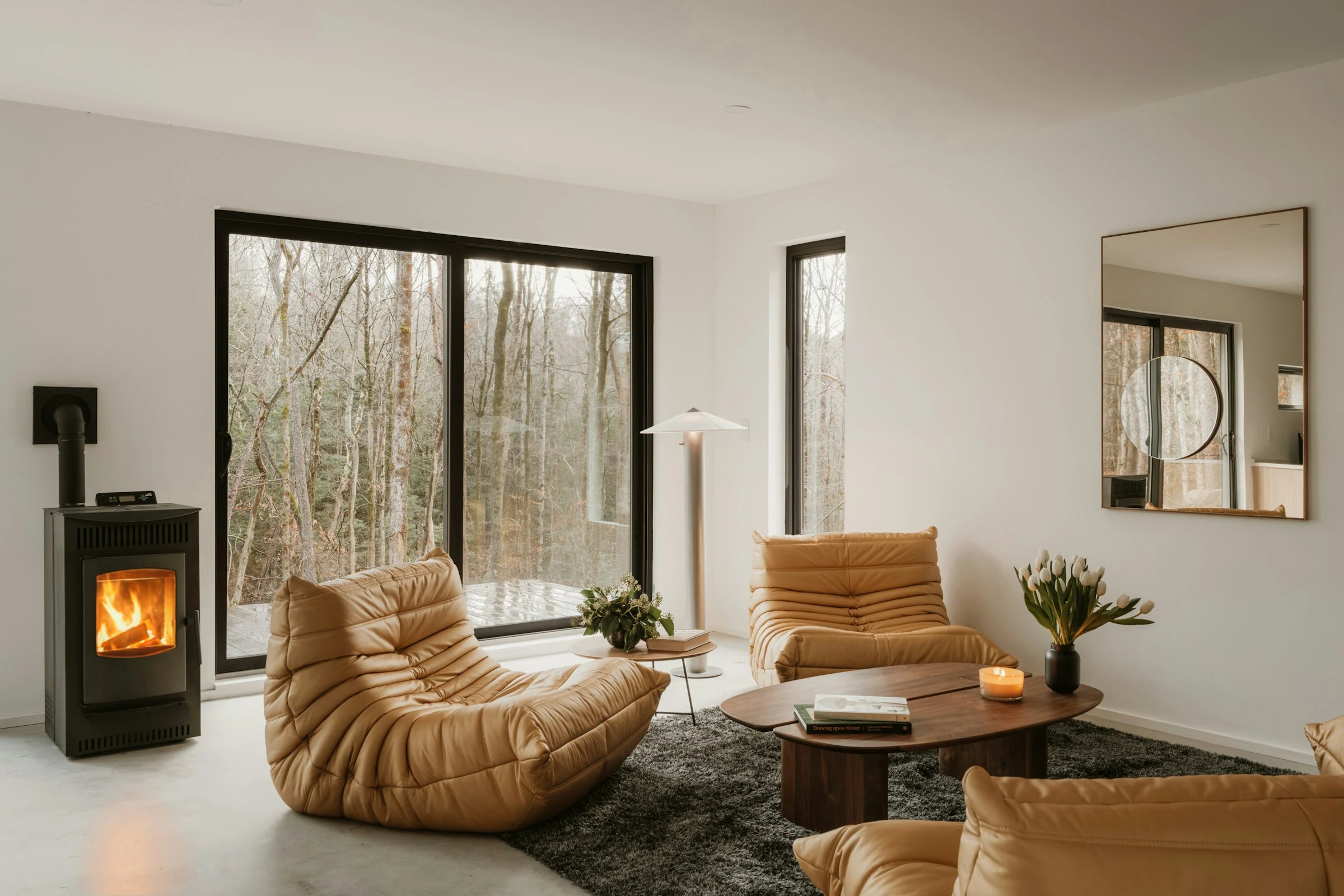 Architectural inspiration: a real home with a large picture window overlooking woodland